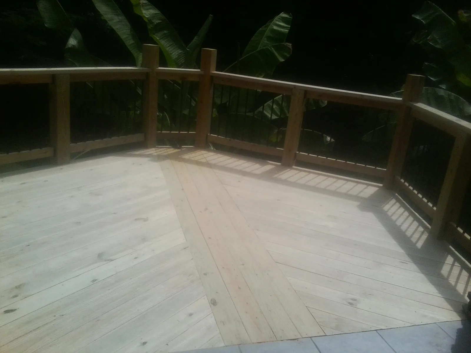 New wood deck and railing built off the back of a home in Helena